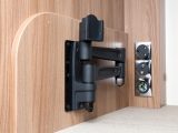 There are two places for the TV –
 one bracket swings out from the washroom wall above the wardrobe