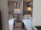 The 7.49m-long 8065dF has these fixed twin single beds, with a washroom beyond