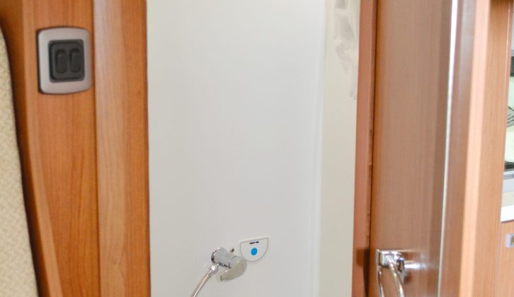The offside washroom is a space-saving one, so the toilet floor doubles as the shower tray – note the domestic-style access door