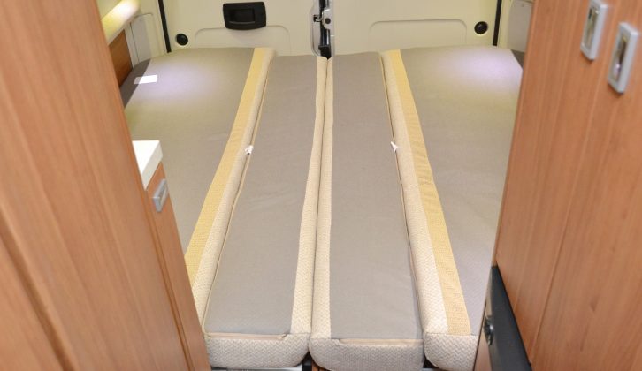 Slats that pull into the gangway and a set of rearranged seat cushions are all that’s required to form the large double bed