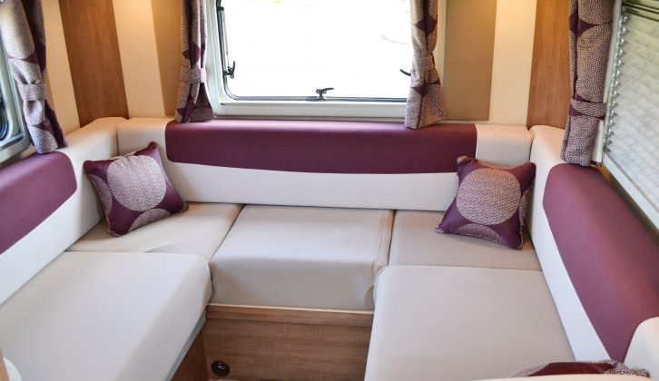 The rear lounge's purple-and-cream colour scheme looks modern, while the aluminium curtain poles add a smart domestic touch