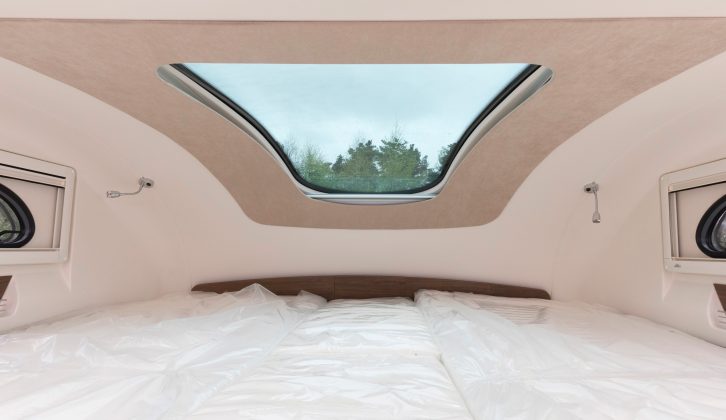 The longitudinal bed-space above the cab can be used as either a double or single beds –
there’s a rooflight and, on either side, a spotlight