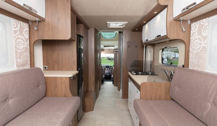 This layout has some neat design solutions, providing fixed beds, sofas, extra travel seats, a kitchen and a great washroom
