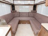 The large rear lounge has wraparound seating with high backs and, in the corner, headrests for extra comfort