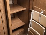 As well as carrying the steps, the shelved cupboard has plenty of storage for folded clothes and other paraphernalia