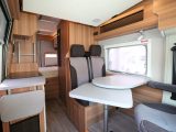 The Weinsberg CaraBus 601 DQ sleeps five, with a longitudinal double over the cab, a make-up single here in the dinette and a transverse double at the rear