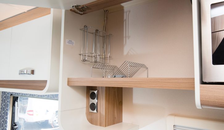 The overhead kitchen locker facing has a pleasing curved profile – inside you’ll find crockery racking, plus a cereal box-friendly height