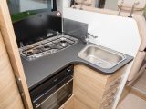 Work surface is a little tight in the kitchen of this Adria motorhome, limited to the area in front of the hob and the trapezoidal sink, so it’ll be best to deploy the lids