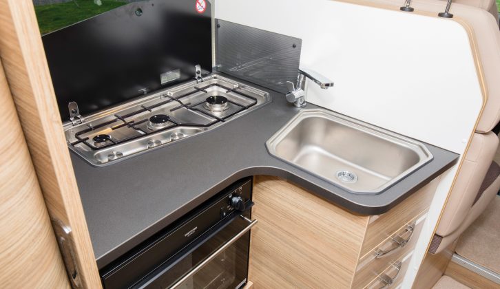 Work surface is a little tight in the kitchen of this Adria motorhome, limited to the area in front of the hob and the trapezoidal sink, so it’ll be best to deploy the lids