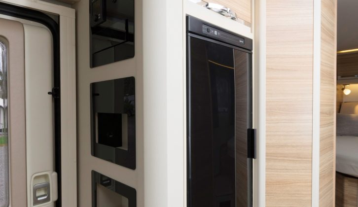 Adria’s ‘media wall’ is the ideal place for stashing a tablet and a smartphone, and includes a built-in USB charging point – and here's the fridge, opposite the main kitchen