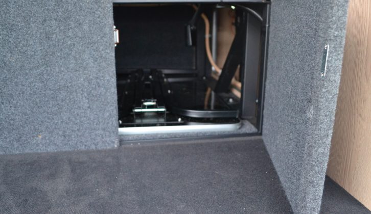 The storage area under the rear seat has enough space to hold the table when not in use, and can be accessed from the front or the back