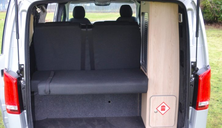 The back of the camper van provides substantial boot space, with an under-seat cupboard and a locker for storing two gas bottles