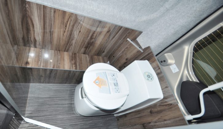 The Dometic ceramic swivel-bowl toilet has a room all to itself – on production models, the window is blacked out