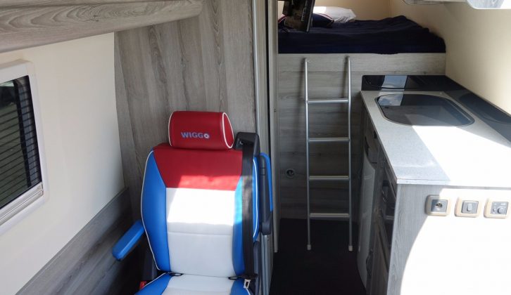 There's a small dinette, a double bed at the rear, with a kitchen and washroom in between
