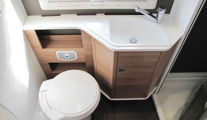 There's a Thetford electric-flush swivel toilet and a smart sink in the Adria's end washroom