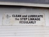 The somewhat vague instruction panel on the step. Which linkage and which lubricant, one might ask?