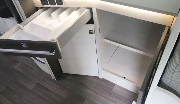 Under the worktop is a pull-out cutlery tray and two cupboards, one of which would be taken up by the Thetford oven/grill in a UK ’van