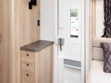 The accommodation door, a new style for 2018, now features a window with a blind, and a couple of handy storage pockets