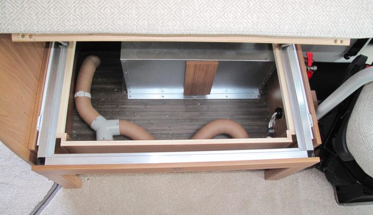 There’s storage space under both the sofas up front, but the nearside one houses a section of space-heating pipe