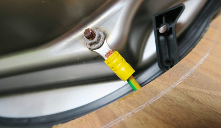 If your kitchen sink is metal and located near electrical cables, there will be an earth cable attached to it, which you will also need to remove