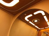 This is a very stylish motorhome, as these ceiling lights, reflected in the washroom's mirror, demonstrate