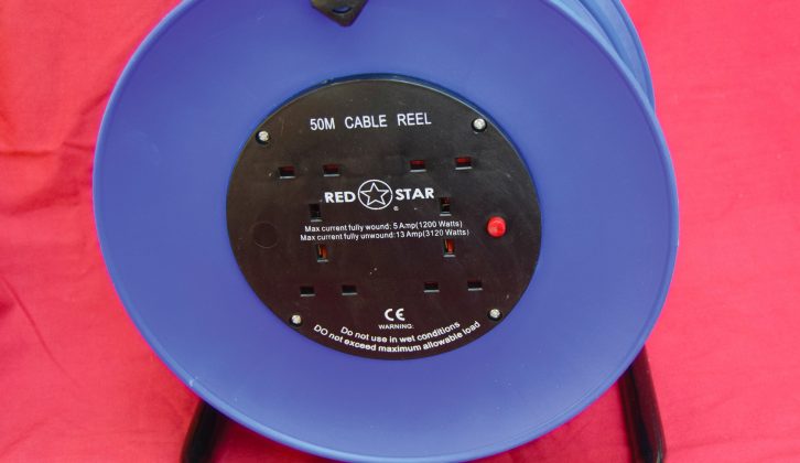 The first step is to remove the cable reel socket plate and disconnect the three-core cable from it