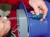 Mount the box on the cable reel with four M3.5 screws and nuts (tweezers can be used to hold nuts while tightening)