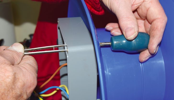 Mount the box on the cable reel with four M3.5 screws and nuts (tweezers can be used to hold nuts while tightening)