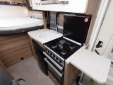 The kitchen is well equipped, with a dual-fuel hob, a separate oven and grill, a microwave and a fridge