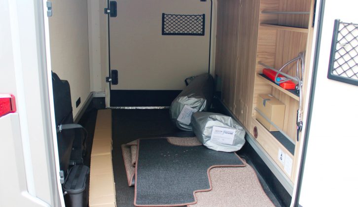 The rear garage has loads of space, two access doors, a heater vent, some handy shelving and a 350kg load limit