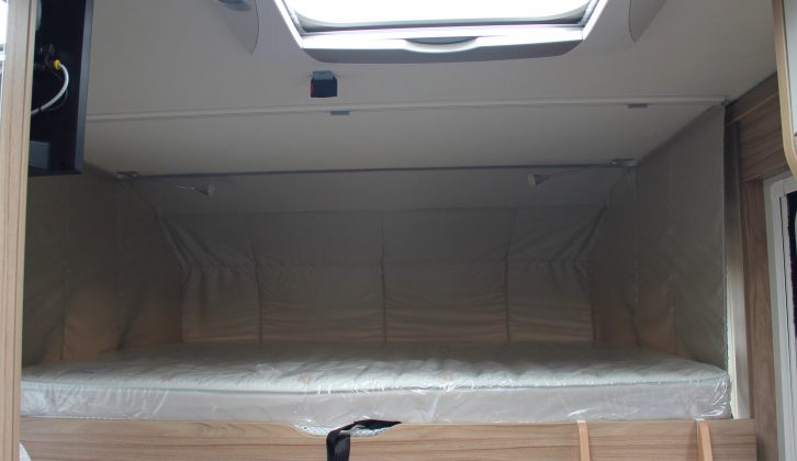 The pull-down double bed over the front lounge is accessed via a ladder