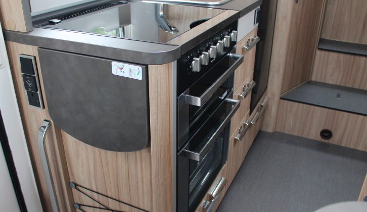 The side kitchen has a handy tip-up flap and a three-burner hob – this separate oven and grill is a £750 option
