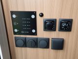 Easily accessible controls for utilities are on a wall panel –
 Truma Combi 4 is standard, or 4E if you choose the Comfort Pack