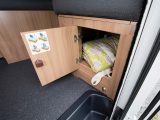 The storage space under the side sofa is clear, although the area beneath the travel seats is mostly taken up by electrics