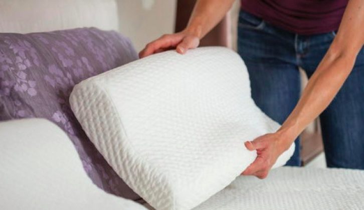 A memory-foam contoured neck pillow helps to ease painful necks and backs