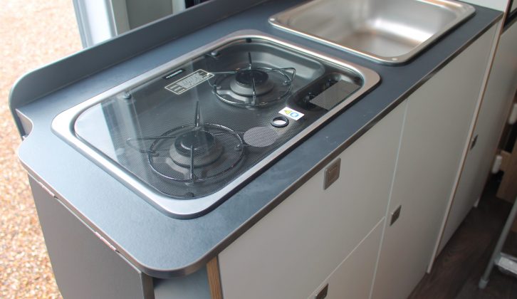 Cooks get a two-burner Dometic gas hob with a glass cover, a square sink and a 90-litre fridge/freezer, but there's no oven
