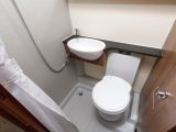 Kitchen space might be impeded by the all-in-one washroom's door