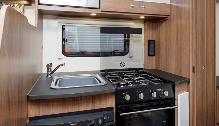 The 76-4's offside kitchen is stylish, if compact