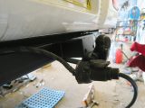 The towbar and the necessary electrics are both attached, and the electrics are tested