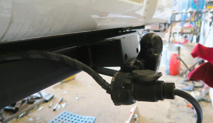 The towbar and the necessary electrics are both attached, and the electrics are tested