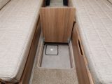 This floor hatch between the parallel sofas provides discreet storage, ideal for valuables