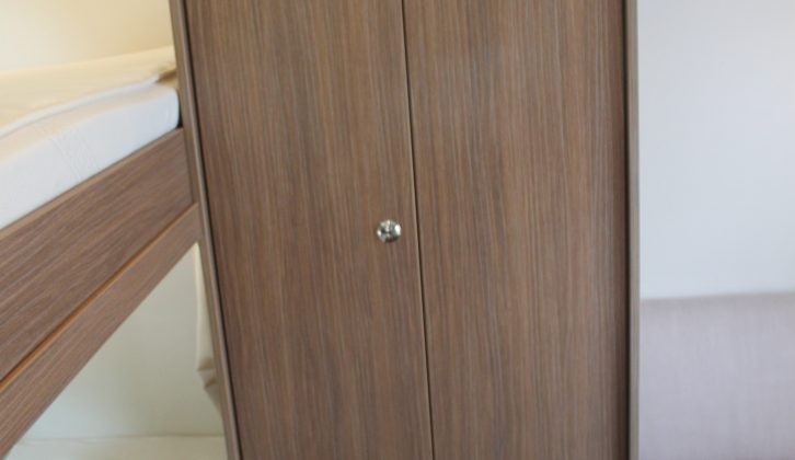 This double-doored wardrobe with a cupboard below is at the centre of the rear double dinette
