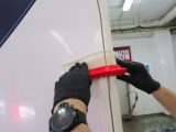 A flexible silicone blade is effective for drying difficult corners on a motorhome