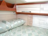 The rear bed is well lit with a rooflight, a trio of windows, a striplight and two spotlights