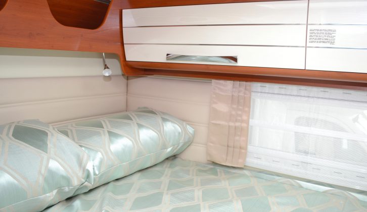 The rear bed is well lit with a rooflight, a trio of windows, a striplight and two spotlights
