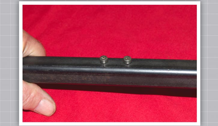 The M4 x 6 cap head screws, temporarily located in the tapped holes, will be used to locate the lever on the support fulcrum bolt