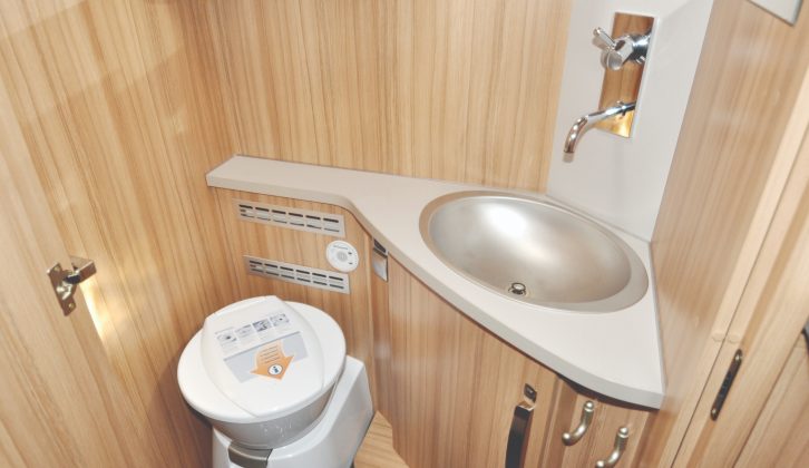 Toilet room has Dometic’s more upmarket ceramic-bowl model.