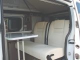 The rear bench seat has two seatbelts, allowing a total of three passengers, and makes up into a double bed