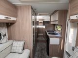 The Avantgarde 194 is a four-berth with high fixed single beds over a garage at the back and a front dinette with two parallel sofas that make a second double