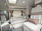 It has a definitely Symbol-style lounge, with a forward-facing seat inside the sliding door providing a third travel seat